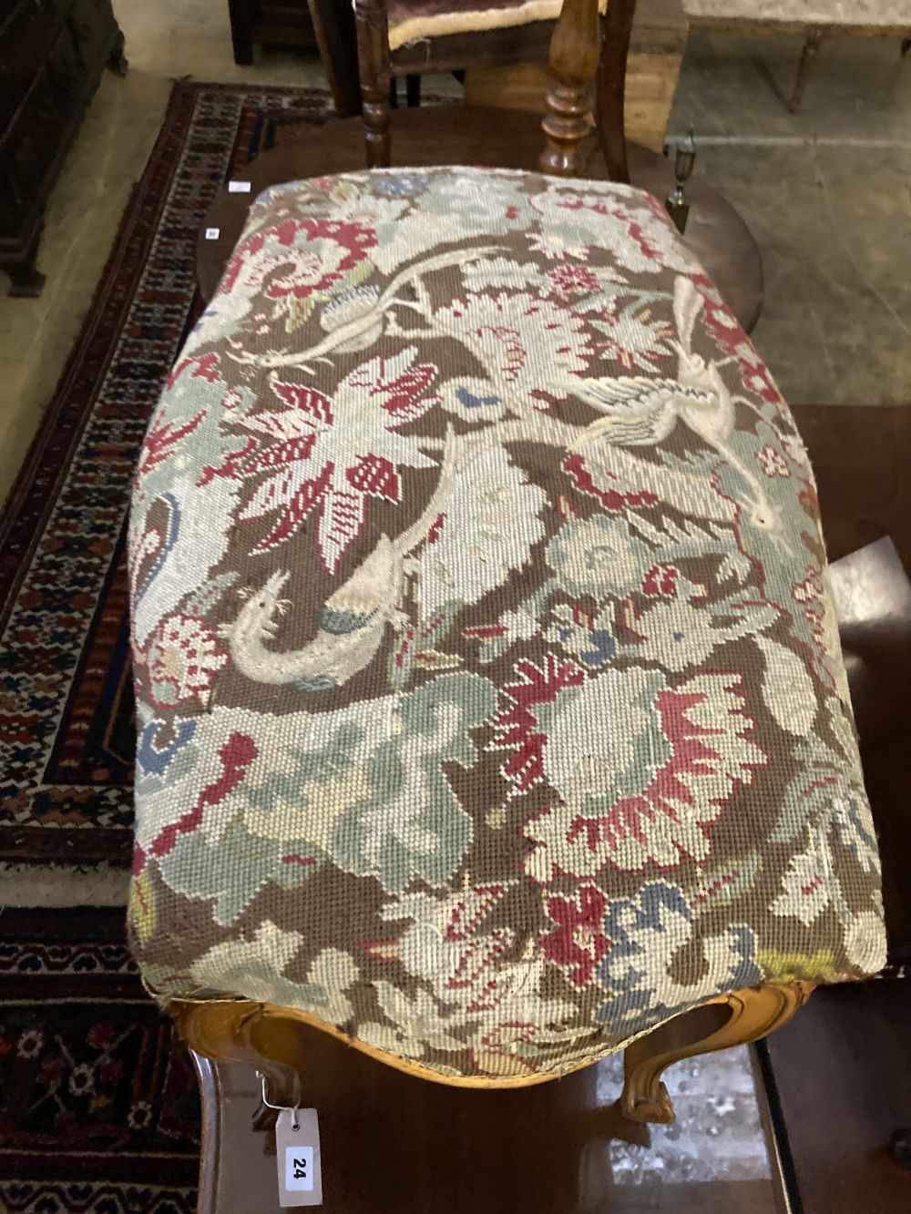 A Louis XVI style walnut dressing stool with tapestry seat, width 76cm, depth 46cm, height 50cm